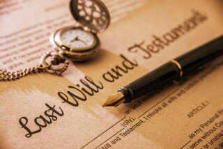 document reading last will and testament with pocketwatch