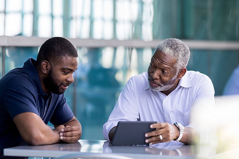 father and son reviewing estate plan