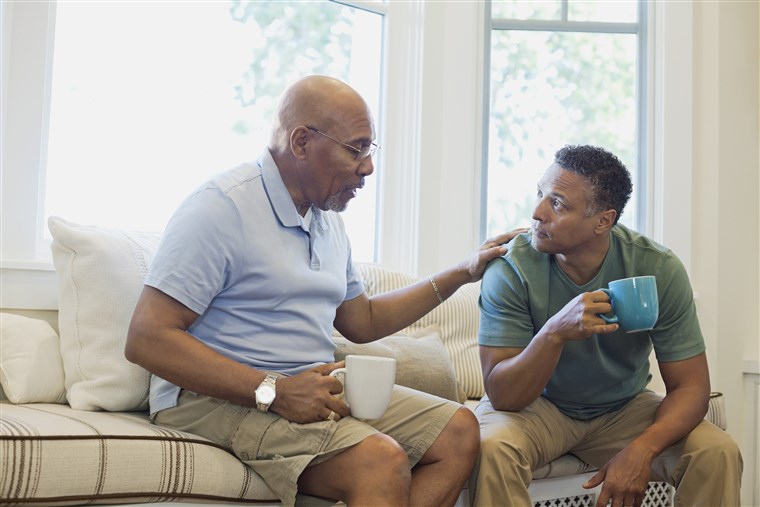 Elder parent and son having a conversation