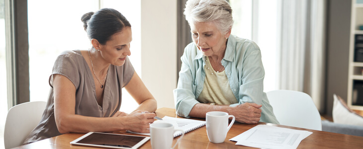elderly woman consulting with an estate planning attorney