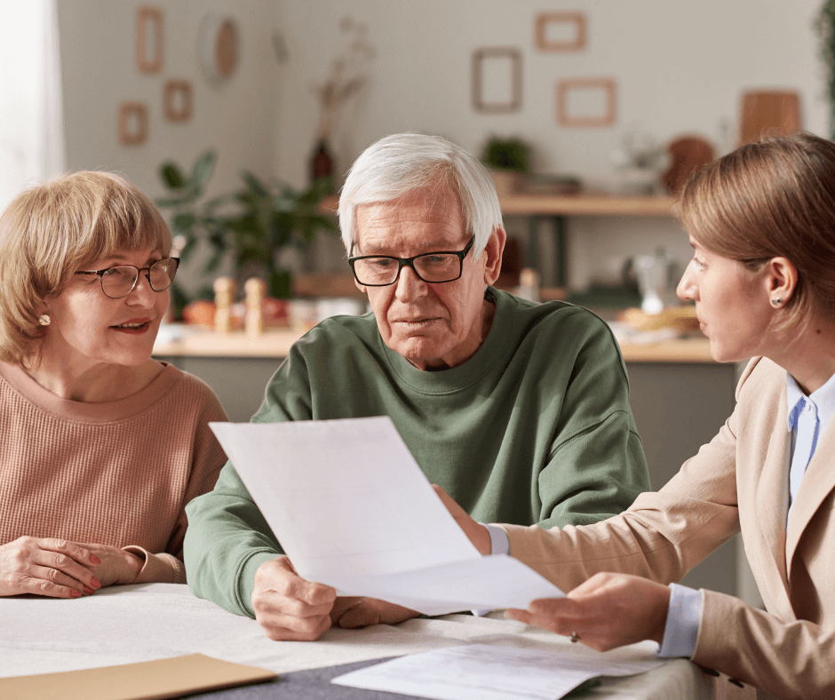 Older couple sitting with estate planning attorney