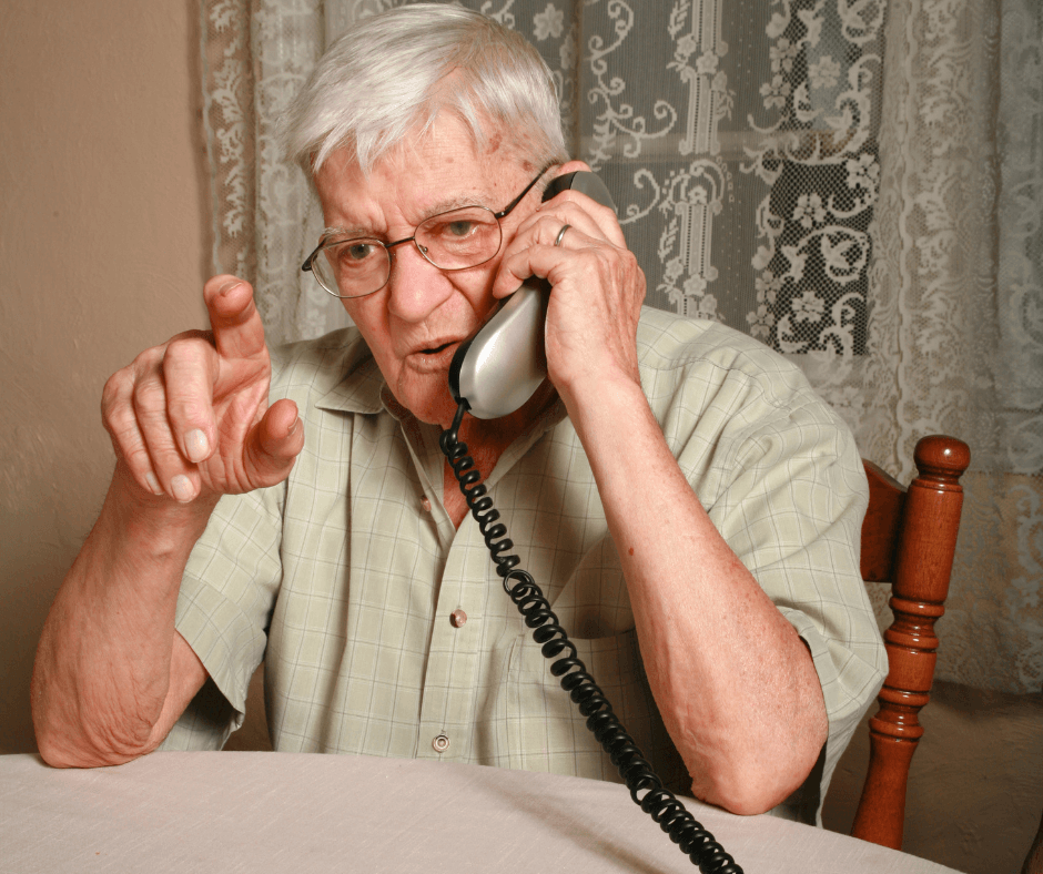an elderly man on the telephone