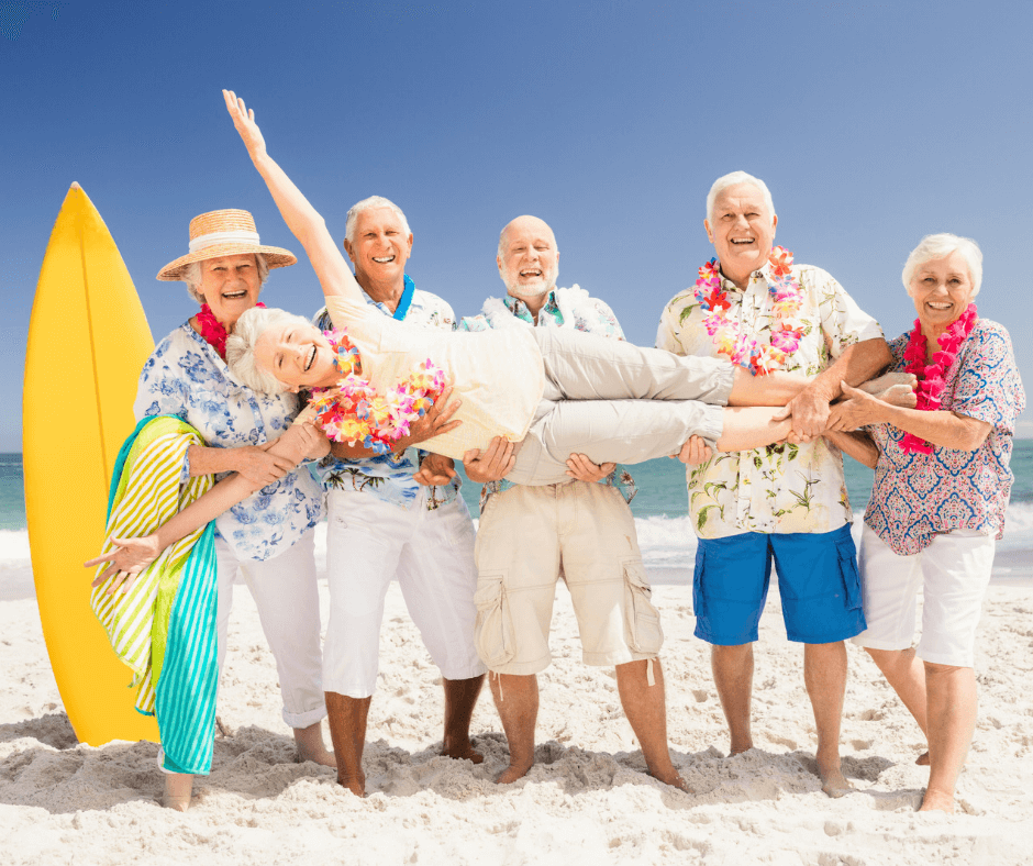 senior citizens having fun at the beach