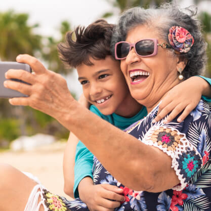 Grandma taking a selfie with young grandson