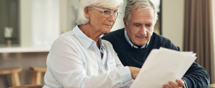 Elderly couple looking at estate planning documents