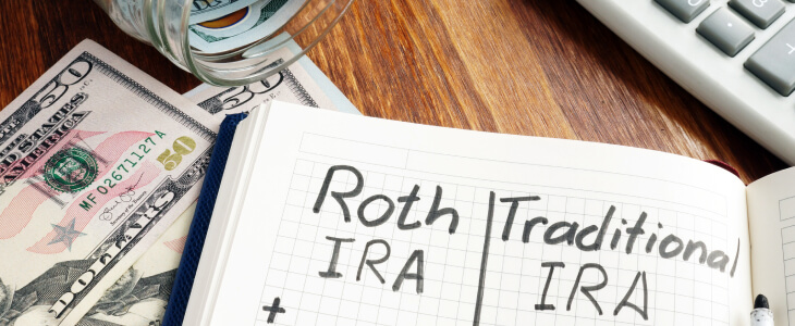 Notebook with Roth IRA and Traditional IRA written down