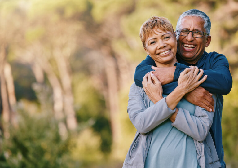 Gen x couple hugging and smiling