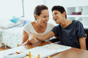 Disabled boy smiling with mother