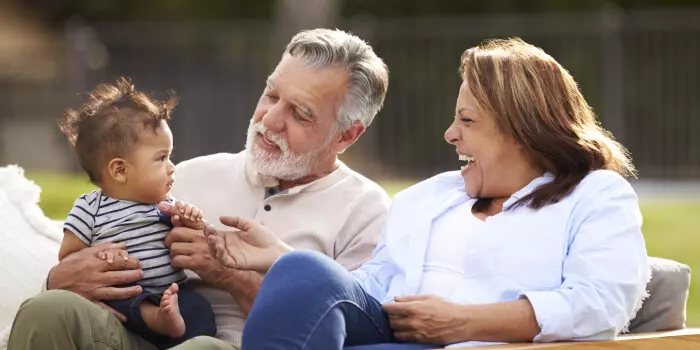 grandmother and grandfather with baby grandson
