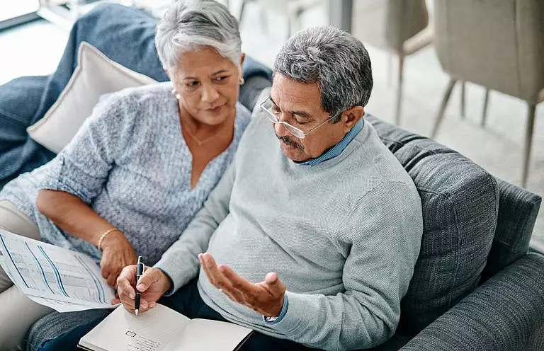 A couple discussing their secrets as they create their estate plan.