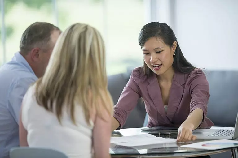 Estate planning attorney helping a couple navigate their will.