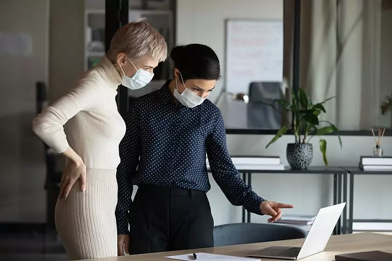 Two women looking over an advanced directive.
