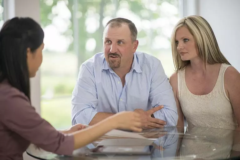 young couple with estate planning attorney