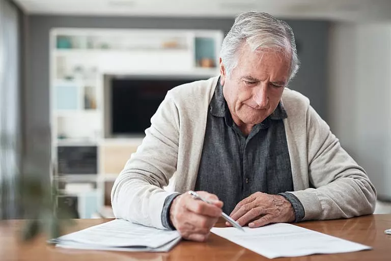 Elderly man composing his estate plan
