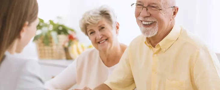 elderly couple speaking with an attorney about asset protection and trusts