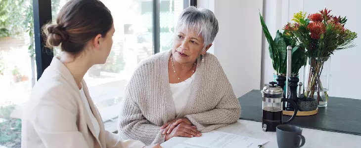 Elderly woman discussing estate plan with lawyer