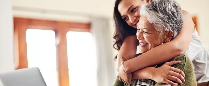 elderly woman with her daughter looking at the laptop for a virtual estate planning attorney