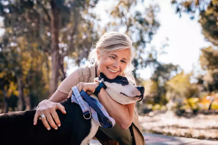 Older woman with pet dog