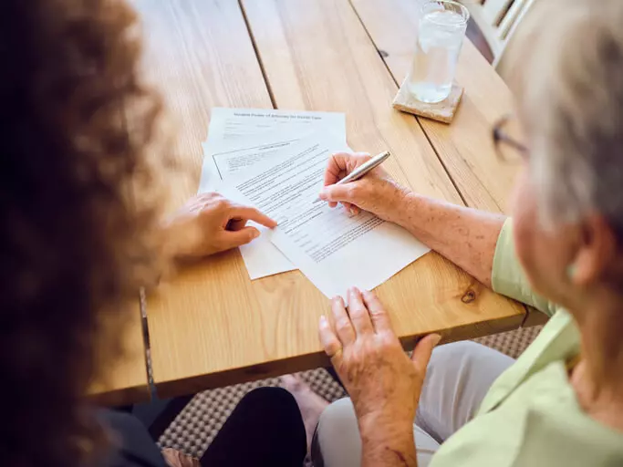 Woman working on her estate plan with attorney