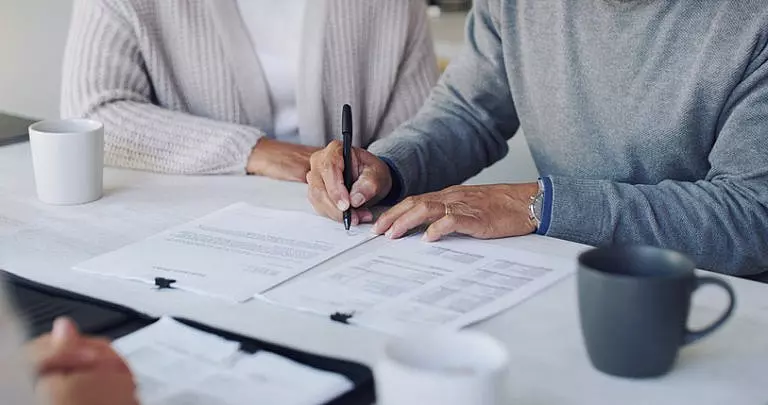 Woman signing estate planning documents