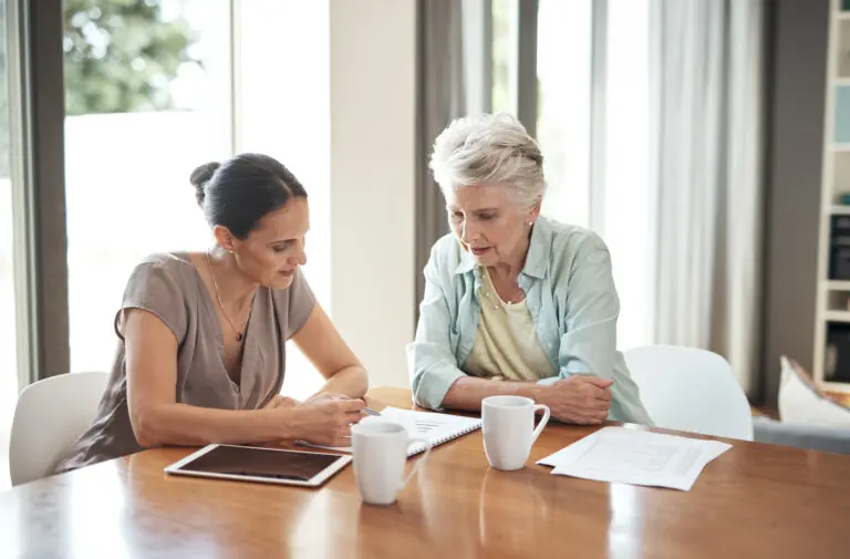 elderly woman meeting with attorney