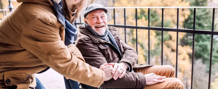 Disabled elderly man with adult child