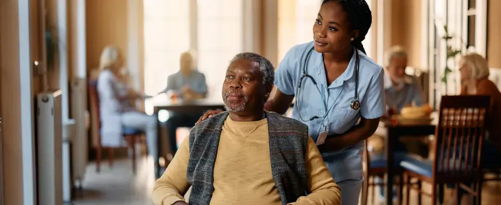 Elderly man and a nurse at a nursing home