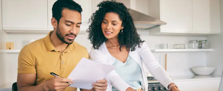 Unmarried couple looking at documents