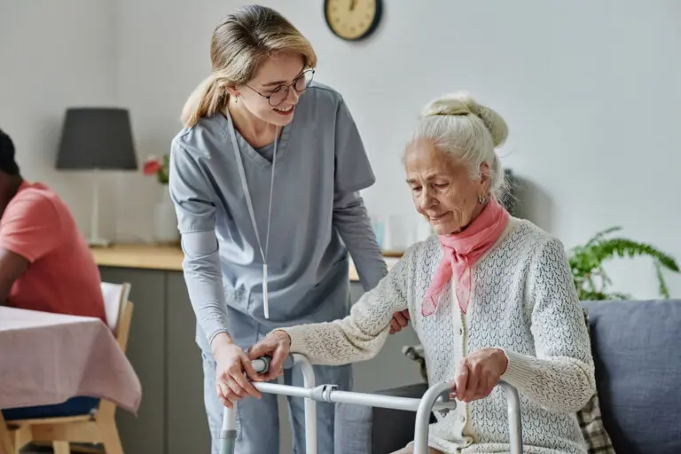 Caretaker with elderly woman in a nursing home