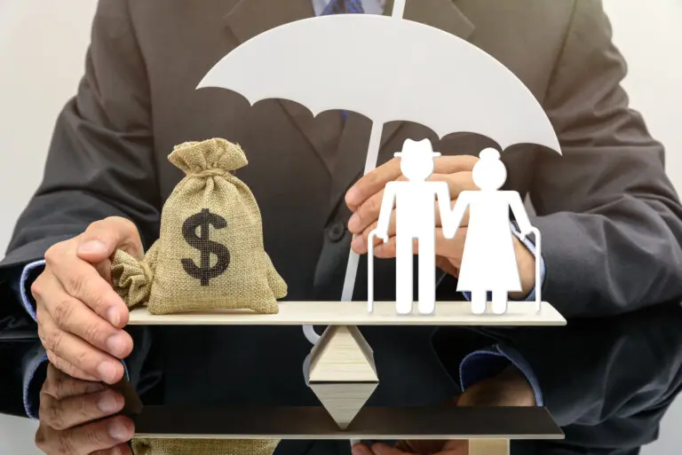 Bag of money and paper cutout of an elderly couple balancing on a scale