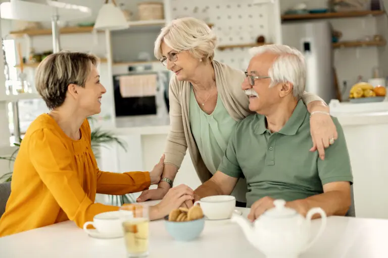 Happy woman visiting her senior parents