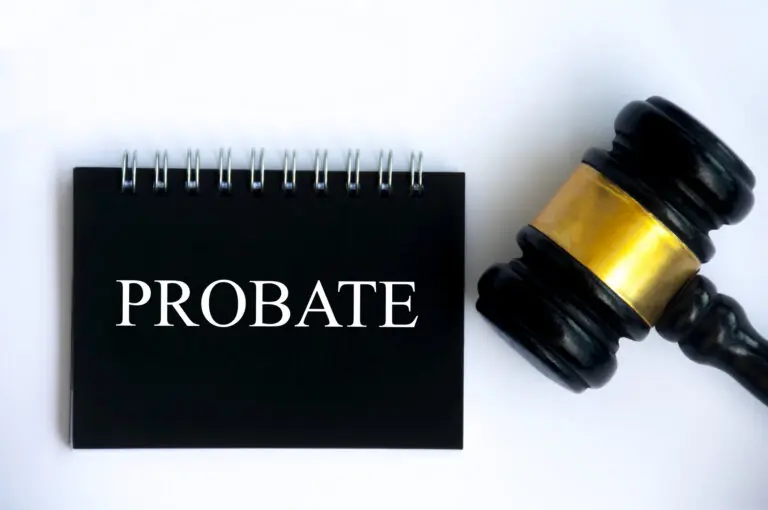 Probate text on black notepad and gavel on white cover