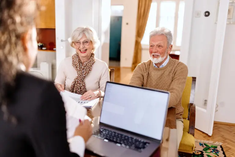 Smiling senior couple talking about their will