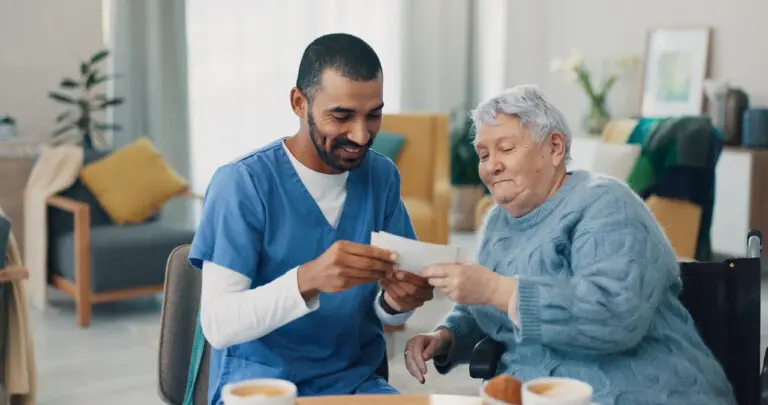 caregiver with old woman in retirement