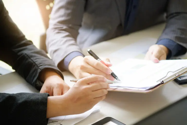 business man talking to consult report paper of financial in office.