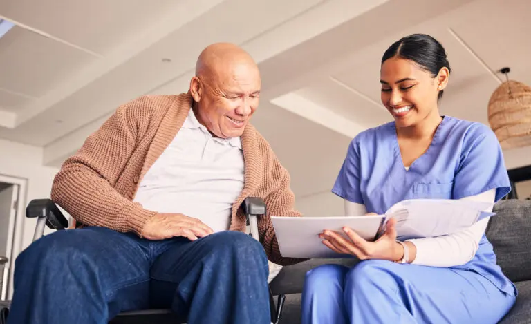 Old man, wheelchair or caregiver reading documents, history or healthcare documents at nursing home