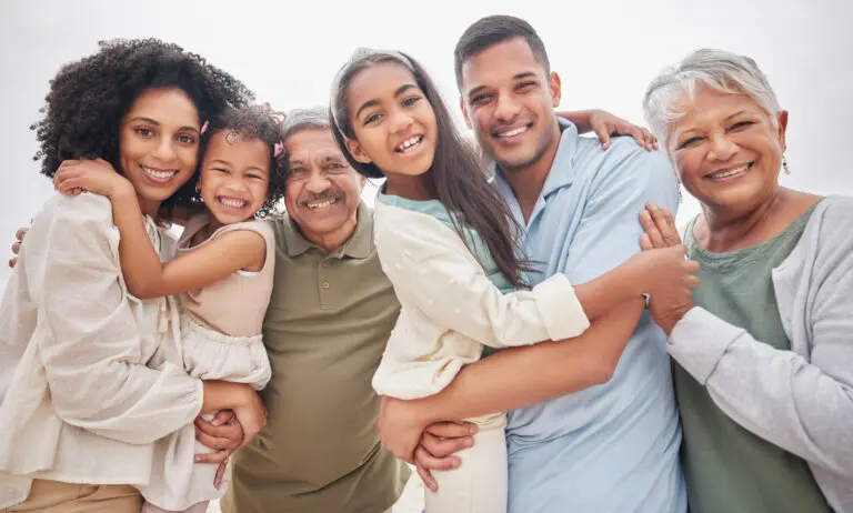 Portrait, smile and big family outdoor on holiday, vacation and travel together in nature. Face, happy grandparents and parents with children bonding, care and hug for love, support and connection