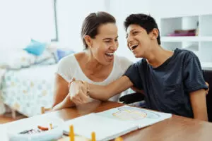 Disabled boy smiling with mother